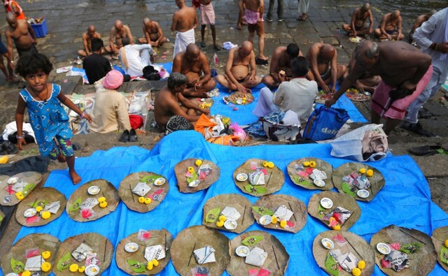 Leaves arranged with pooja materials in Mumbai on the occasion of Mahalaya. Many families also perform 'shraadh' during the 15-day mourning period that ends on Mahalaya. The Associated Press/ Rafiq Maqbool Leaves arranged with pooja materials in Mumbai on the occasion of Mahalaya. Many families also perform 'shraadh' during the 15-day mourning period that ends on Mahalaya. The Associated Press/ Rafiq Maqbool